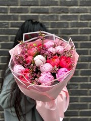 Romantic bouquet of peonies in pink tones