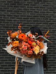 Exclusive orange-medium bouquet with dahlias, strelitia, gerberas Exclusive orange-medium bouquet with dahlias, strelitia, gerberas